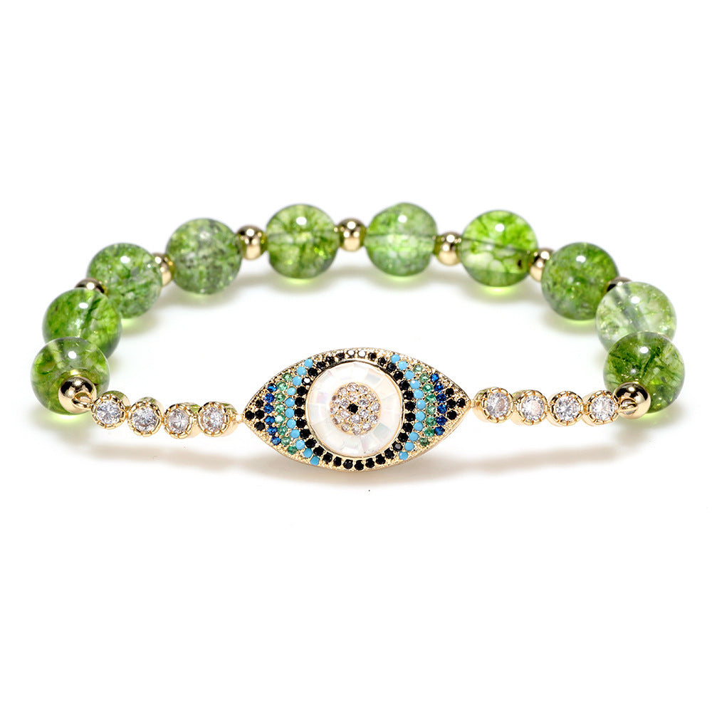 Pulsera de Ojo Turco con Piedras de Peridoto – Protección y Elegancia Dorada.